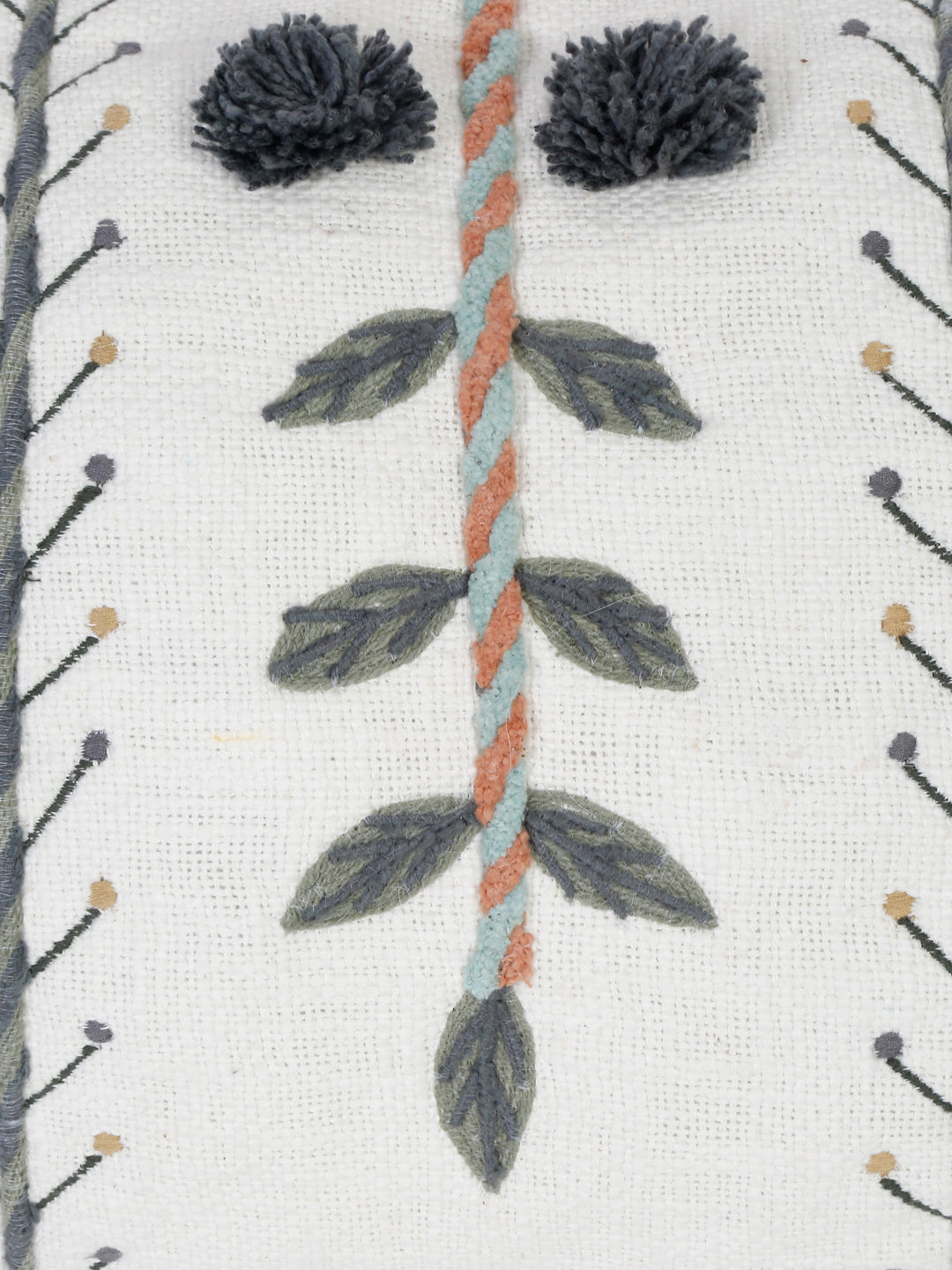 Hand embroidered cotton pillow cover styled on sofa